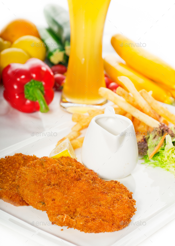 classic Milanese veal cutlets and vegetables Stock Photo by keko64